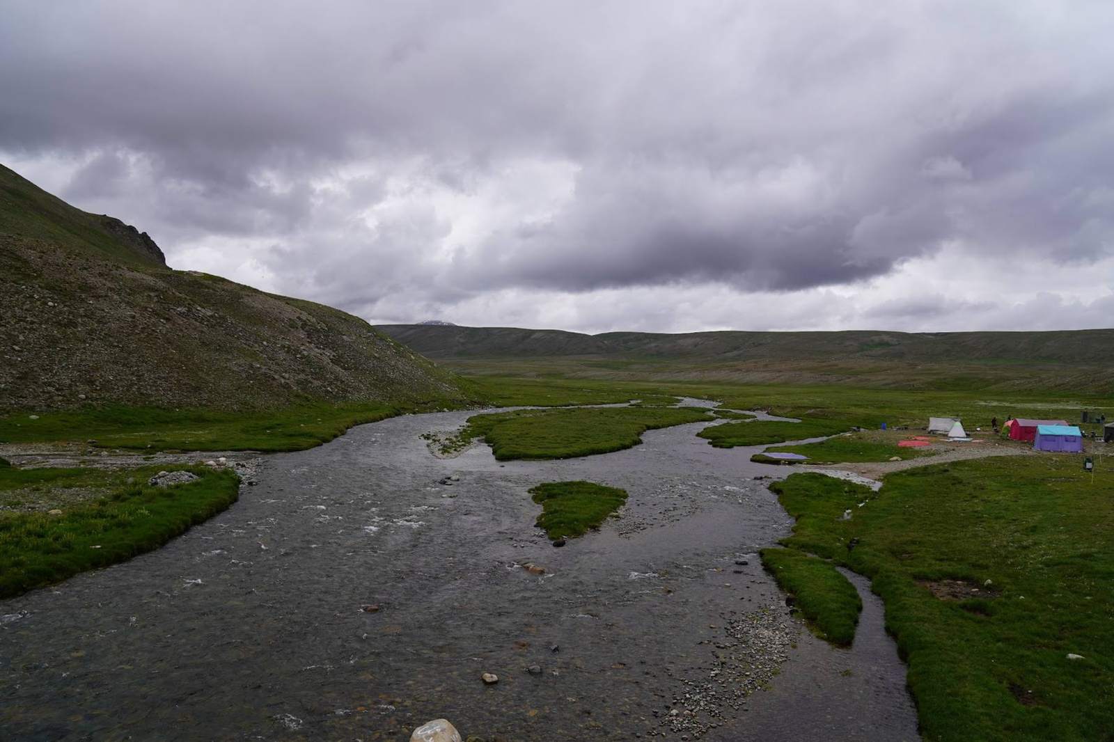 A river crossing the Deosai plains with a Travelore campsite