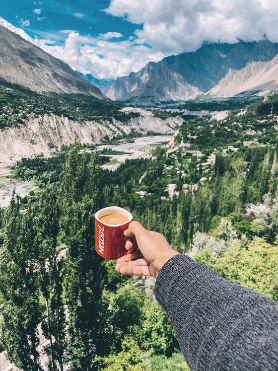 Tea held over the green Hunza valley