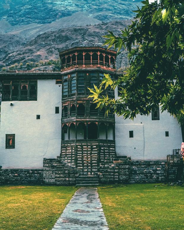 The white walls and carved wooden tower of Shigar Fort